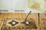 Vintage Oushak runner with a dark chocolate stepped medallion, ivory star, and geometric border.