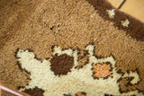 Plush pile detail of vintage Oushak rug, showing ivory, bronze, and faded tangerine diamond motifs.