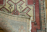 Hand-knotted weave of a vintage Turkish Oushak rug, revealing its secured side.