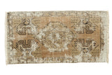 Faded hand-knotted Oushak runner, distressed geometric medallion in coffee and charcoal brown, 1'8