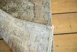 Distressed vintage Oushak runner's hand-knotted back and faded coffee, charcoal, ivory pile.