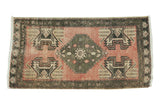 Hand-knotted blush and moss green Oushak rug, stepped medallion, floral planter motif, 1'9
