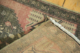 Hand-knotted foundation and secure edge of a Turkish Oushak rug with ivory fringe.