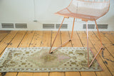 Vintage Oushak rug runner's softened hexagonal medallion and star patterns in muted beige, mauve.