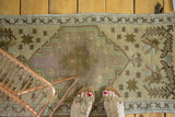 Traditional vintage Oushak runner: hexagonal medallion, quadruple star design, soft beige, mauve tones.