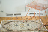 Distressed Turkish Oushak runner with faded rose, gold, charcoal stepped medallion and splayed florals.