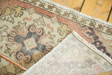 Vintage Oushak runner: distressed hand-knotted pile, faded peach, ivory patterns, visible fringe.