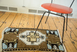 Vintage Oushak rug mat corner with powder blue motif and ivory fringe.