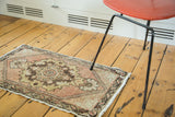 Distressed Oushak runner corner, faded peach, ivory, gold floral spandrel, barber pole border.