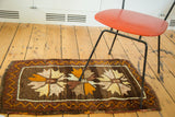 Vintage Oushak rug floral medallion in tangerine orange, saffron yellow, peach, and zigzag border.
