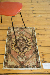 Distressed vintage Oushak runner corner showing peach, saffron gold floral spandrel.