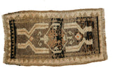 Hand-knotted Oushak rug with octagonal medallion and tendrils in earth tones, black, peach.