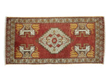 Vintage Oushak runner, cherry red, stepped medallion, ivory and saffron germinating planter motifs.
