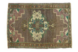 Vintage Oushak rug mat, quatrefoil medallion, floral details in ivory, pistachio, aqua, and mauve.