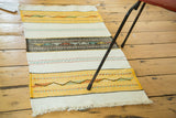 Hand woven vintage Turkish Kilim runner, gold and snow white stripes with varied geometric patterns.