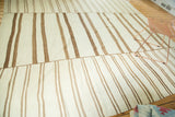 Hand woven Turkish Kilim rug section with ivory and coffee brown linear stripes and stitched join.