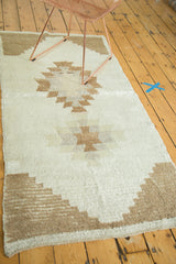 Hand knotted vintage Tulu runner showcasing stepped geometric design in ivory and coffee brown.