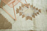 Textured Tulu runner pile with stepped geometric pattern in ivory and light coffee brown.