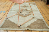 Hand knotted vintage Tulu rug runner with stepped stylization in ivory and light coffee brown.
