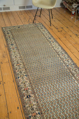 Persian Malayer runner's intricate geometric border and repeating boteh design.