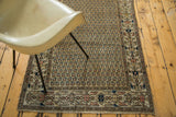 Vintage Malayer runner with sand ground, geometric border, and repeating boteh motifs.