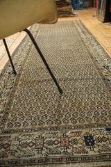 Intricate geometric border and repeating boteh pattern on a vintage Persian Malayer runner.