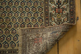 Hand-knotted Malayer runner's foundation, showcasing precise weave and intricate boteh design.