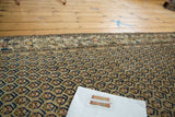 Hand-knotted Malayer runner: geometric border and boteh in sand, charcoal, tangerine.