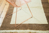 Simplistic vintage Tulu rug with plush ivory and milk chocolate brown border.