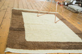 Plush ivory and milk chocolate brown pile of a vintage Tulu rug corner, with fringed end.