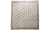 Vintage Dhurrie square carpet with allover diamond pattern and geometric wave border in celadon, red, and ivory.