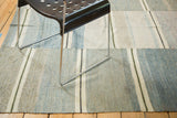 Textured hand-woven blue and ivory stripes on this vintage rag rug.