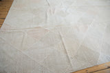 Hand woven Indian kilim carpet with lattice diamond design in pale stone, slate grey, blush.