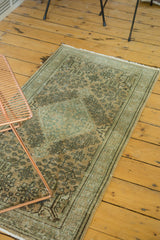 Vintage Turkish Sivas rug, showcasing its distressed intricate allover pattern in muted green and peach.
