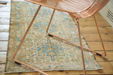 Distressed geometric Karaja runner in sky blue and ivory tones.