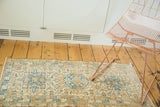Distressed Karaja runner with geometric triple medallions in ivory, sky blue, and coffee brown.