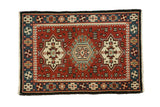 Vintage 1980s hand-knotted Indian rug mat, cherry red, charcoal, bold geometric triple medallions.