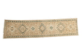 Distressed vintage Karaja runner in ivory and moss green with triple geometric medallions.