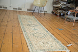 Vintage Karaja runner's geometric triple medallions and serpent border in ivory and moss green.