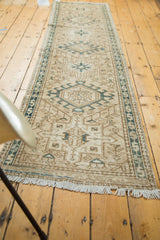 Distressed ivory fringe and geometric pattern on a vintage Karaja runner.