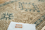 Intricate hand knotted geometric patterns and textured pile on the vintage Karaja runner.