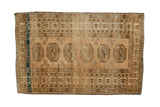 Vintage Afghan rug, six elephant footprint medallions, distressed copper and dark navy aqua.