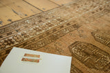 Hand-knotted vintage Afghan rug pile showing abrash in pale copper and bronze tones.