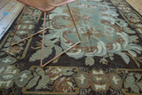 Muted green and brown European rococo-like rose and leaf pattern on vintage Turkish Kilim.