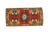 Cherry red vintage Oushak rug runner with bursting medallion and ivory gold planter motifs.