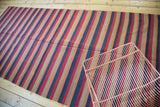 Vintage Turkish kilim with stripe bands in wine red, burnt orange, navy, sand.