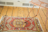 Saffron yellow, mauve, and cinnabar red geometric medallion detail of this Oushak runner.