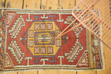 Hand-knotted Oushak runner edge featuring faded cinnabar, saffron, and mauve geometric patterns.