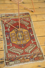 Vintage Oushak rug runner featuring geometric medallion, arrows, and cinnabar, saffron, mauve tones.