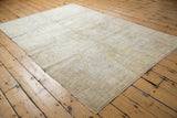 Antique hand knotted Turkish Kaisary rug with subtle floral field and even distress.
